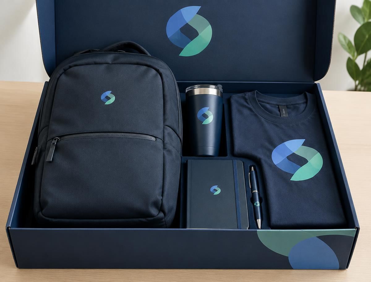 Employee welcome kit box with branded backpack, tumbler, notebook, pen and t-shirt